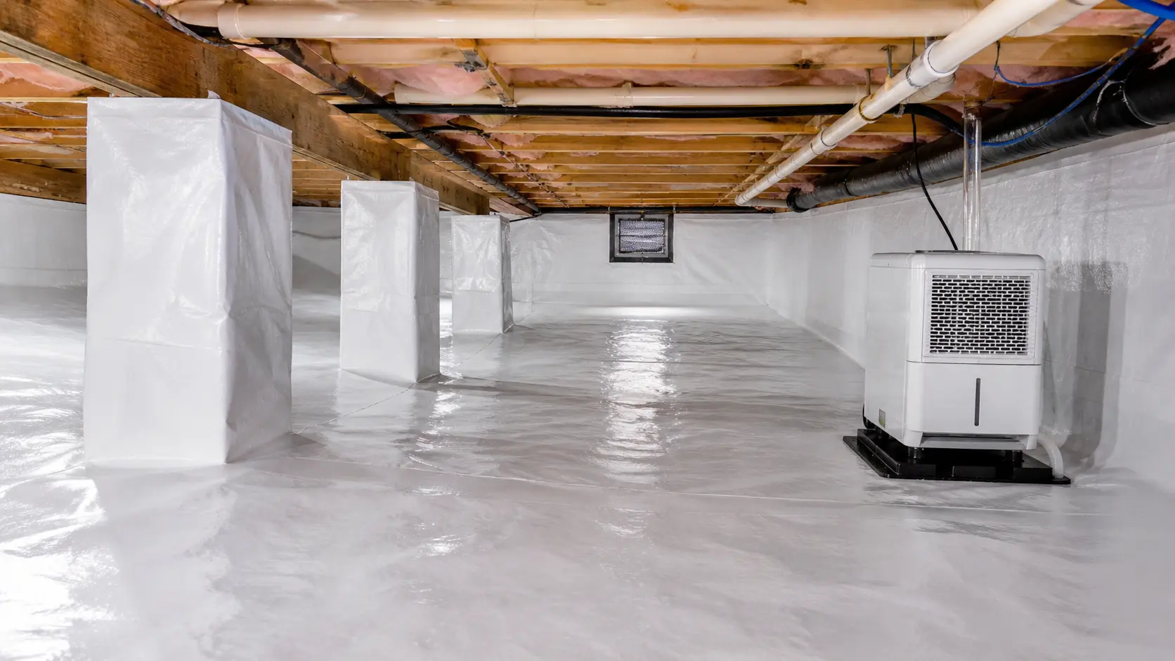 Clean crawl space encapsulation with vapor barrier in a Virginia Beach home